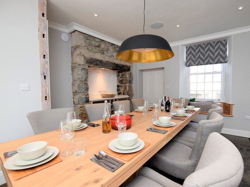 Second dining space with granite fireplace